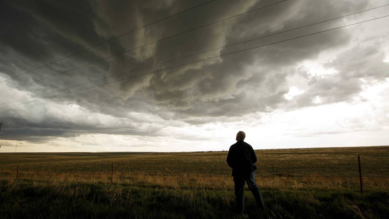 Tim Marshall, a 40 year veteran of storm chasing, monitors a supercell thunderstorm during a tornado research mission, May 8, 2017 in Elbert County near Agate, Colorado. With funding from the National Science Foundation and other government grants, scientists and meteorologists from the Center for Severe Weather Research try to get close to supercell storms and tornadoes trying to better understand tornado structure and strength, how low-level winds affect and damage buildings, and to learn more about tornado formation and prediction. (Photo by Drew Angerer/Getty Images)