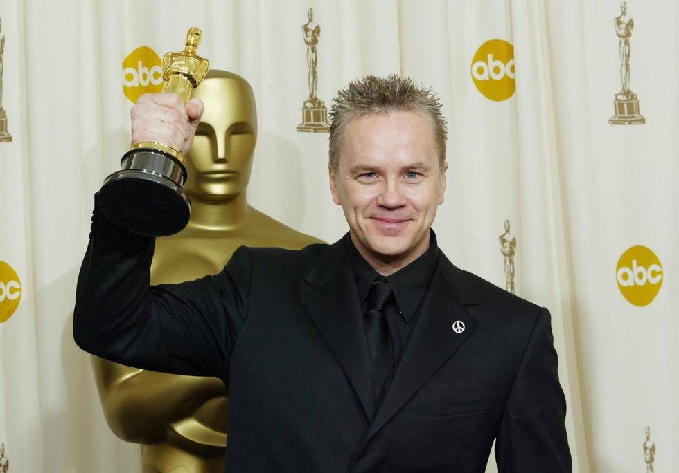Tim Robbins poses with his Oscar for Best Supporting Actor during the 76th Annual Academy Awards at the Kodak Theater on February 29, 2004 in Hollywood, California.