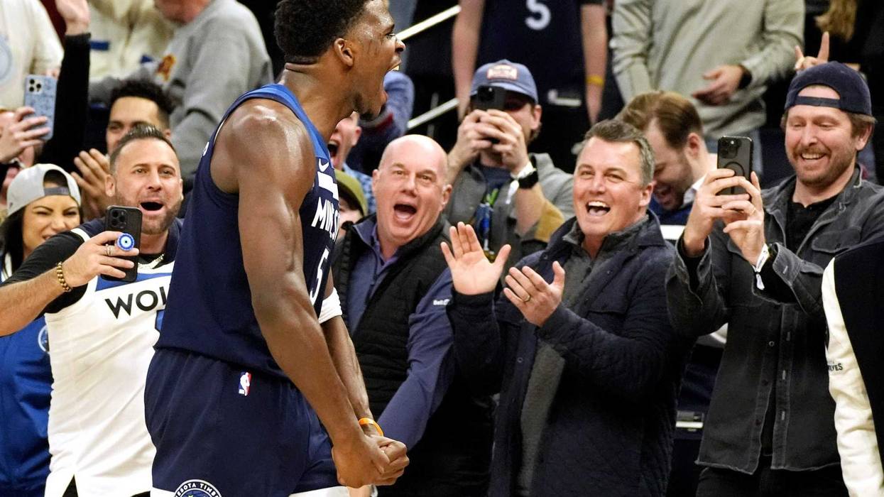 Timberwolves guard Anthony Edwards (5) celebrates his three-point basket against the Los Angeles Clippers late in the fourth quarter at Target Center.