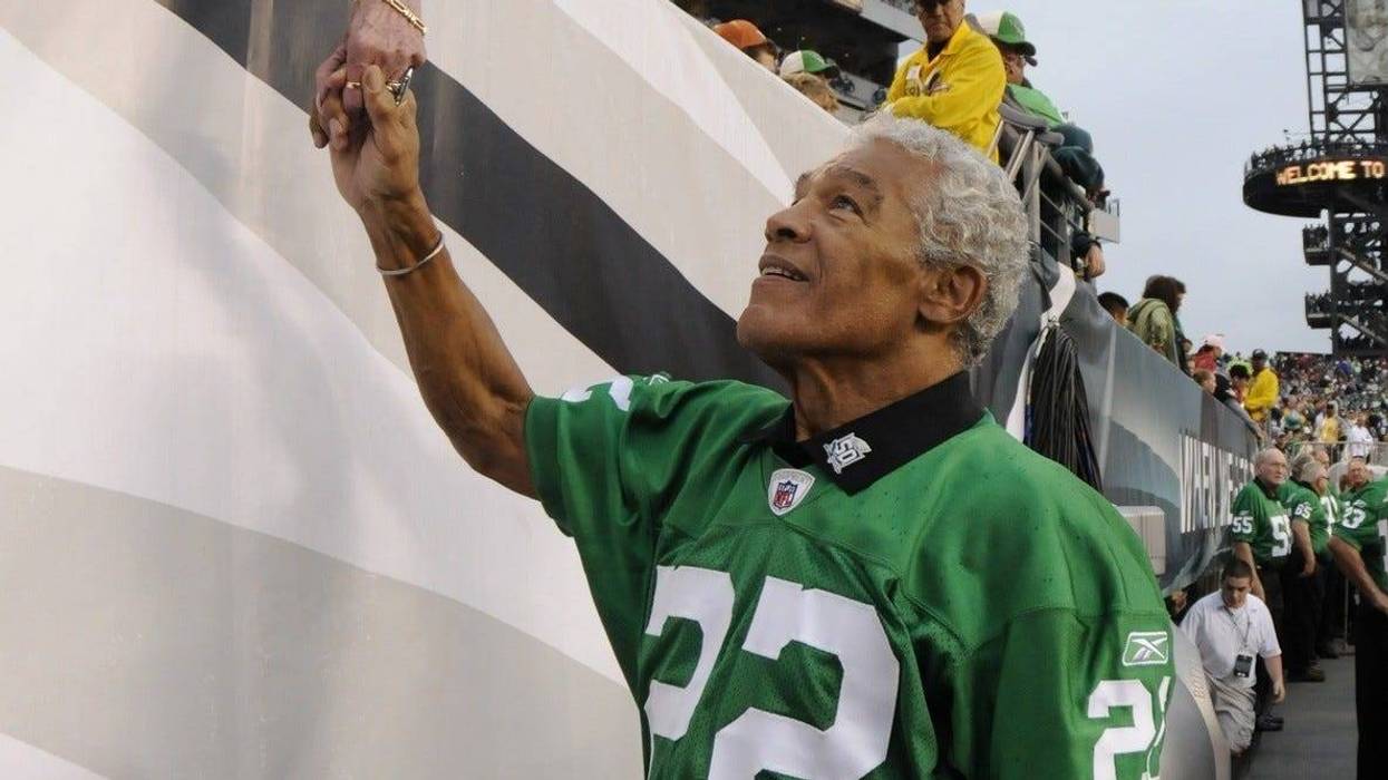 Timmy Brown shakes hands with fans after a ceremony honoring the 1960 NFL Championship team at Lincoln Financial Field.