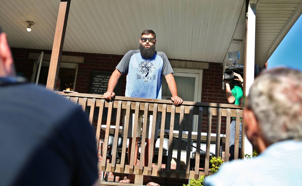 Tioga Mayor David Wilcox speaks to residents from the porch of the municipal building on July 12, 2022. He insisted that several Borough Council members misled him on Loehmann