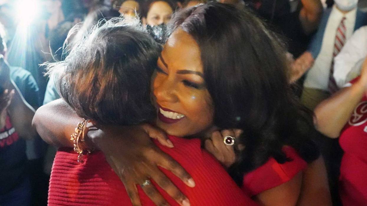 Tishaura Jones hugs a supporter at a watch party