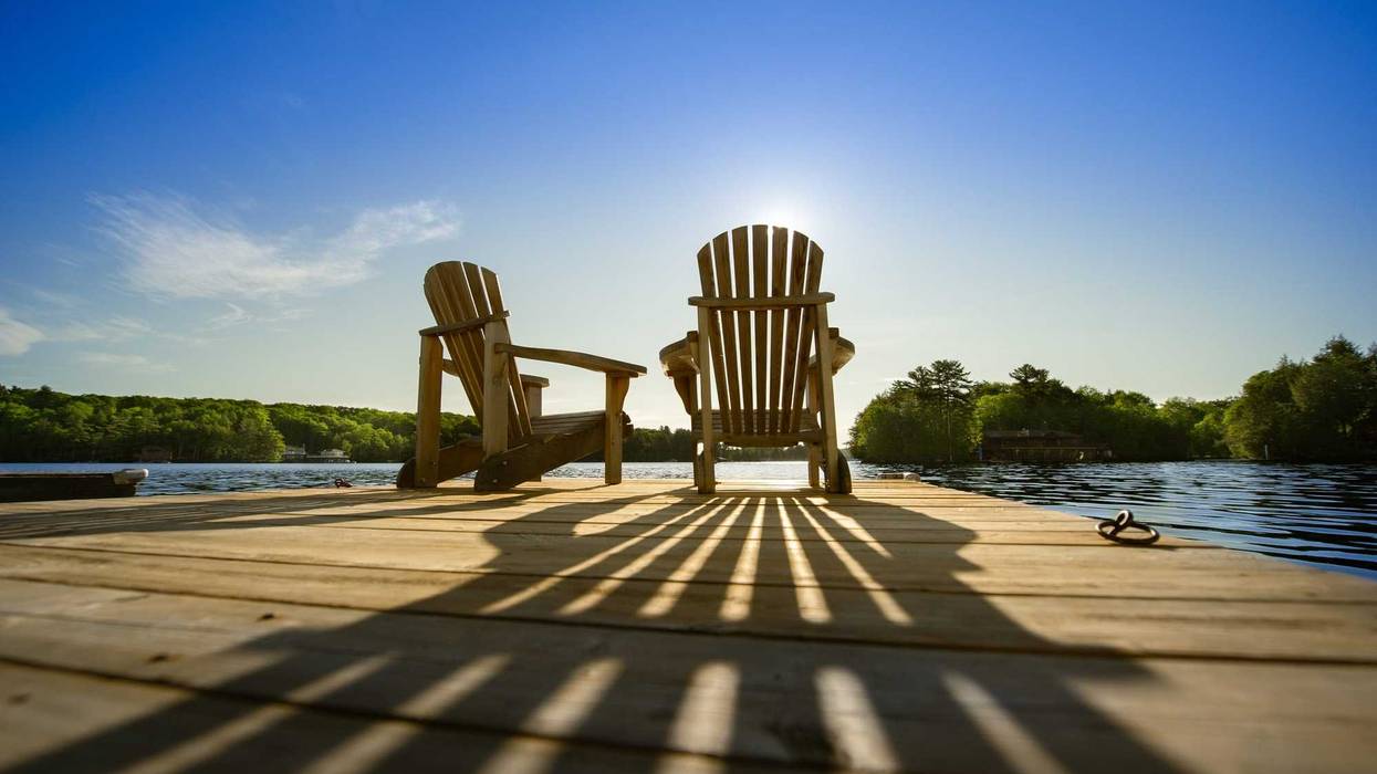 To chairs overlooking a lake, signifying retirement.