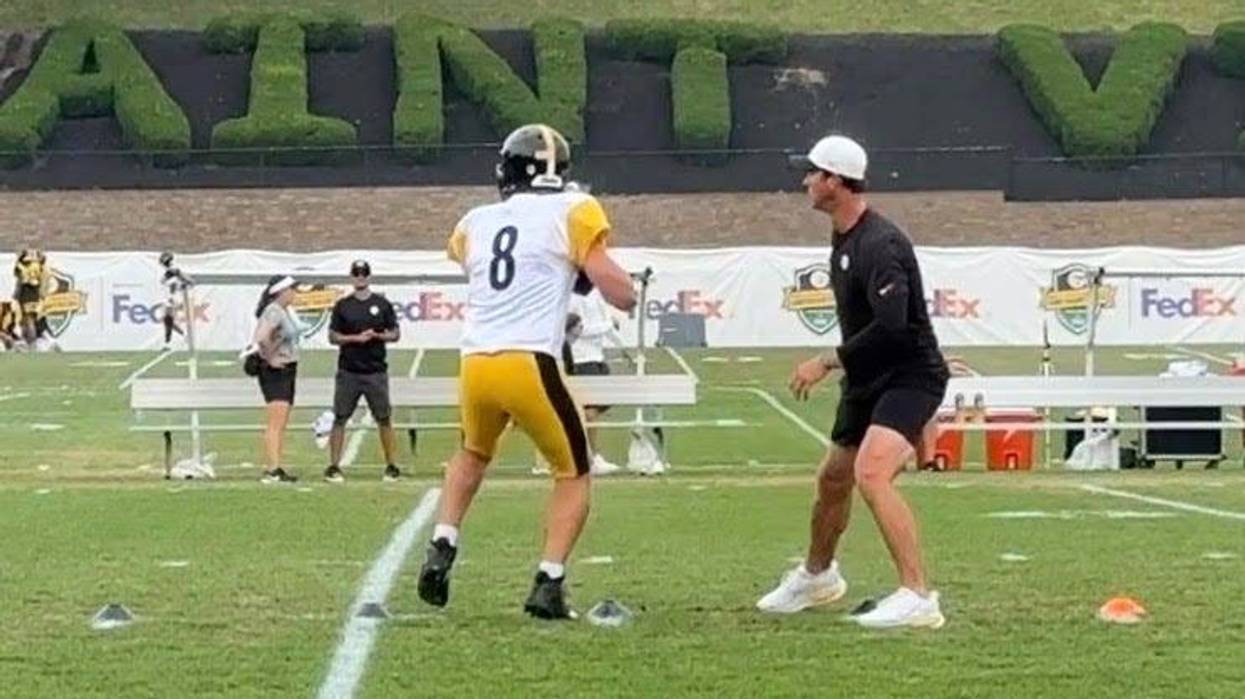Tom Arth and Aaron Rodgers at training camp
