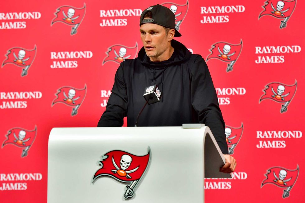 Tom Brady #12 of the Tampa Bay Buccaneers speaks to the media after losing to the Dallas Cowboys 31-14 in the NFC Wild Card playoff game at Raymond James Stadium on January 16, 2023 in Tampa, Florida
