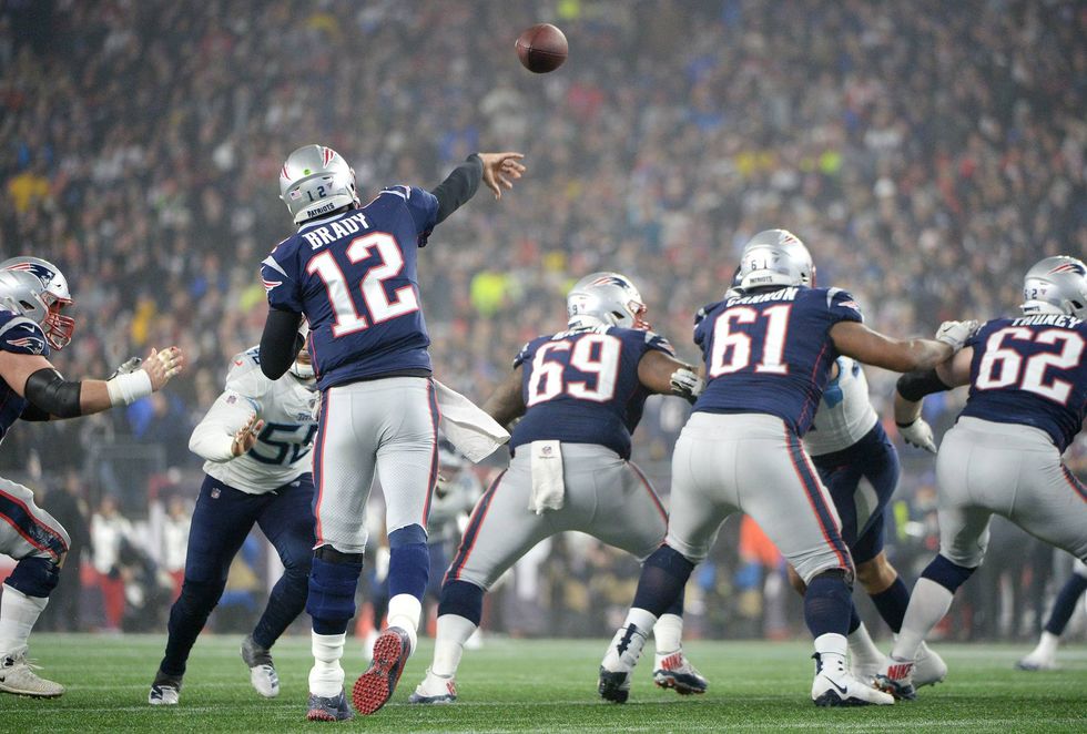 Tom Brady getting off a pass against the Tennessee Titans
