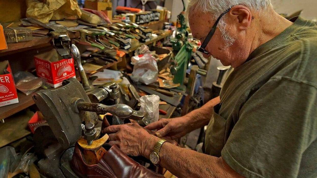 Tony Bonczewski repairs a heel on a customer's shoe at his cobbler shop in Wilkes-Barre, Pa.