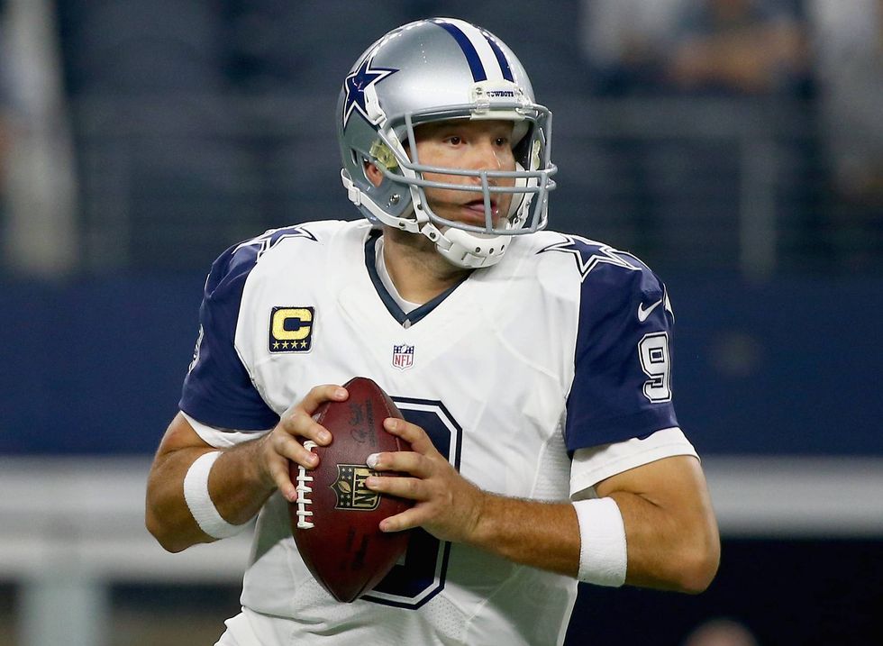 Tony Romo looks downfield for an open receiver