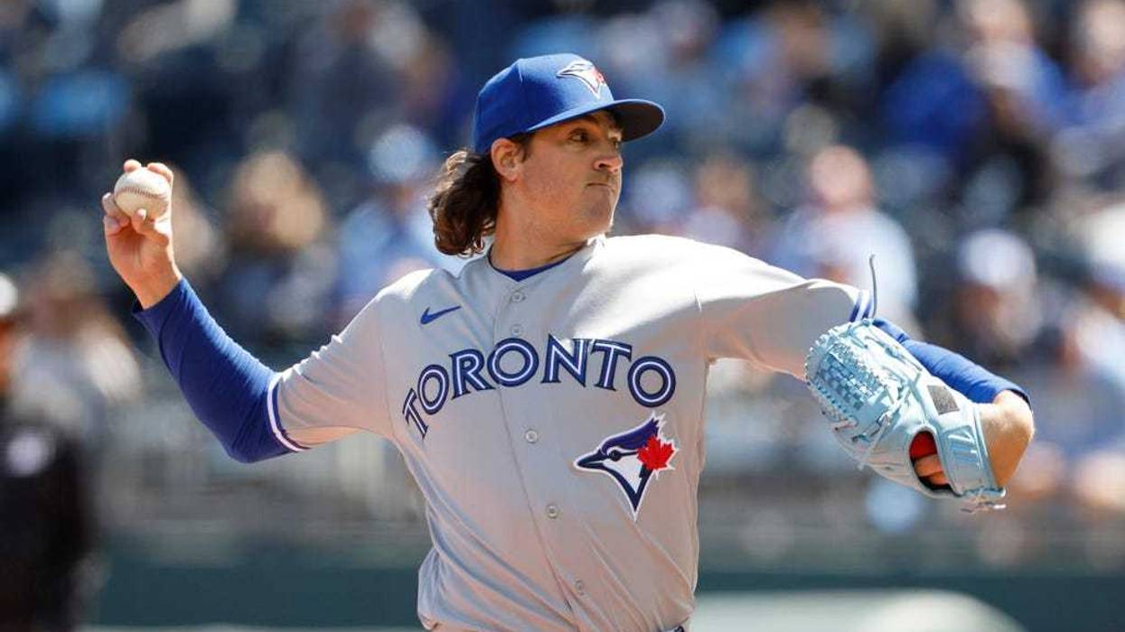 Toronto Blue Jays pitcher Kevin Gausman throws to a Kansas City Royals batter