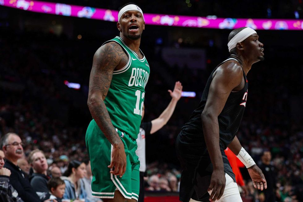 Torrey Craig #12 of the Boston Celtics reacts after making a three-point basket during the third quarter of a game \atb at Moda Center on March 23, 2025 in Portland, Oregon.