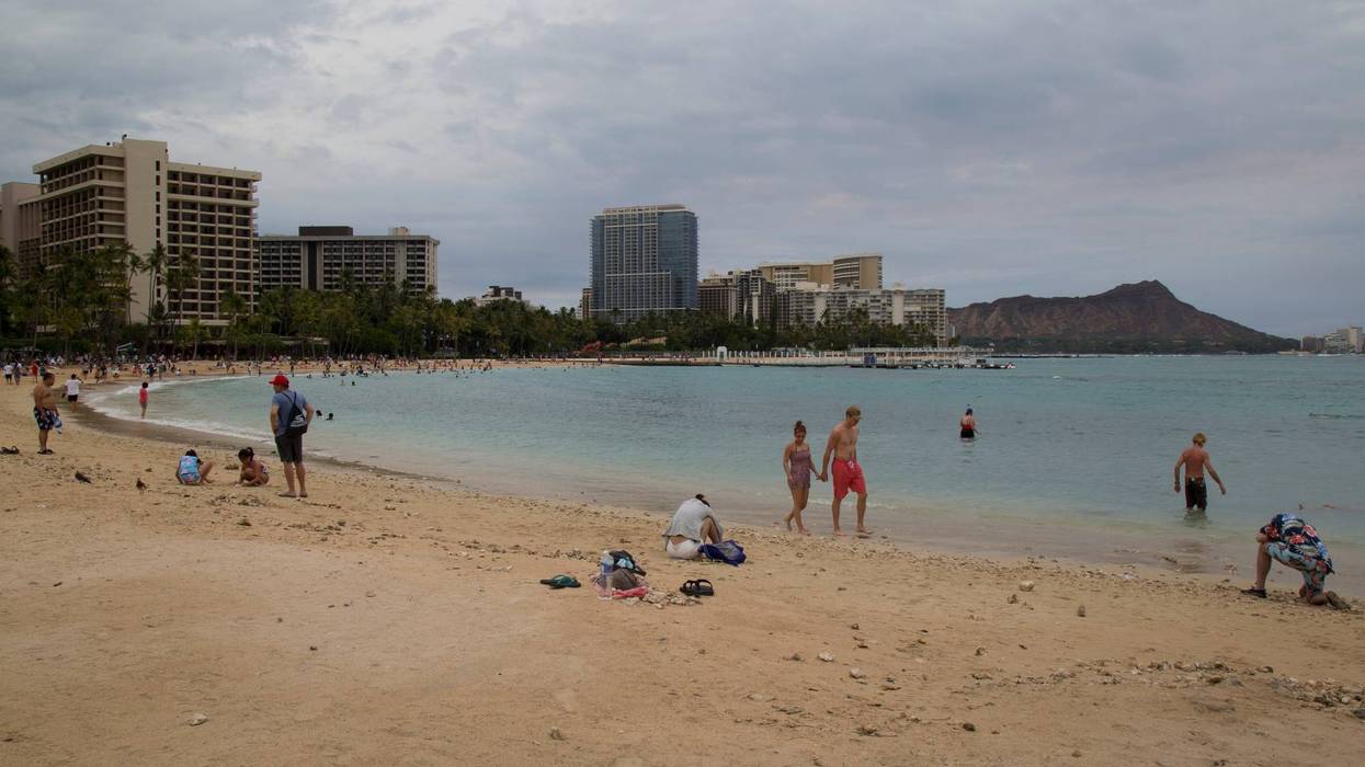 Tourists continue to crowd the beaches as seen from the Hilton Hawaiian Village beach in Waikiki, despite warnings to stay indoors as Hurricane Lane approaches Oahu on August 24, 2018 in Honolulu, Hawaii.