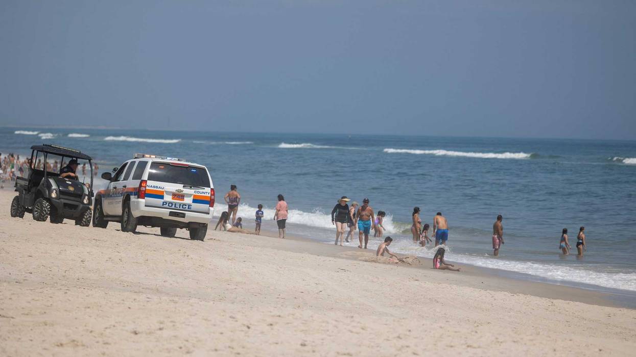 Town of Oyster Bay Constable with public safety and the Nassau County Police keep an eye on the waters off Tobay Beach for sharks on July 14, 2022 in Massapequa, New York.