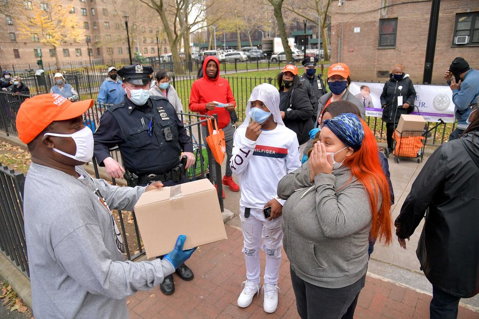 Tracy Morgan (L), Food Bank For New York City, and Council Member Robert E. Cornegy Jr. distribute turkeys to Brooklyn families in celebration of Thanksgiving on November 21, 2020 in Brooklyn, New York.