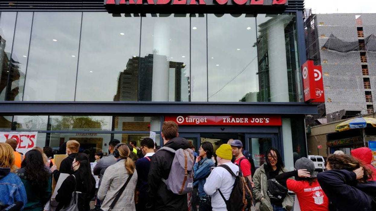 Trader Joe’s employees and union activists hold a rally at a Trader Joe’s in lower Manhattan in support of forming a union at the grocery store on April 18, 2023 in New York City. Workers at the store have complained of slashed benefits, stagnant wages and a lack of concern for health and safety. A union election date for the Lower East Side Trader Joe’s has not yet been set, but if a majority of the employees choose to join, it would be New York City’s first unionized Trader Joe’s. (Photo by Spencer Platt/Getty Images)