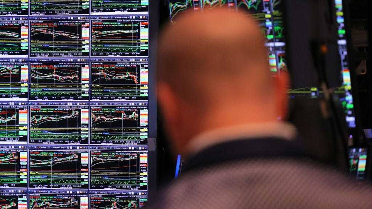 Traders work on the floor of the New York Stock exchange during morning trading on October 18, 2022 in New York City. The stock market opened on an upswing with the Dow Jones gaining over 600 points, the S&P 500 jumping 2.20% and the Nasdaq Composite with a gain of 2.6% adding to the gains that began on Monday. (Photo by Michael M. Santiago/Getty Images)
