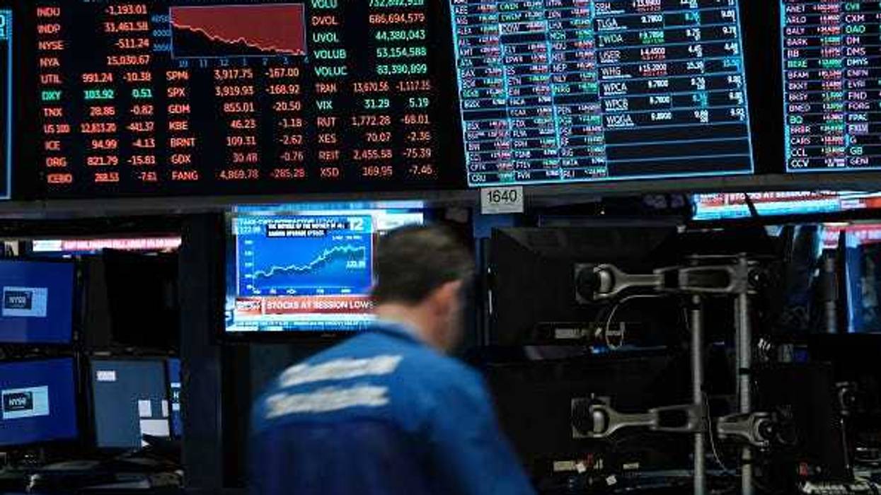 Traders work on the floor of the New York Stock Exchange (NYSE) on May 18, 2022 in New York City.