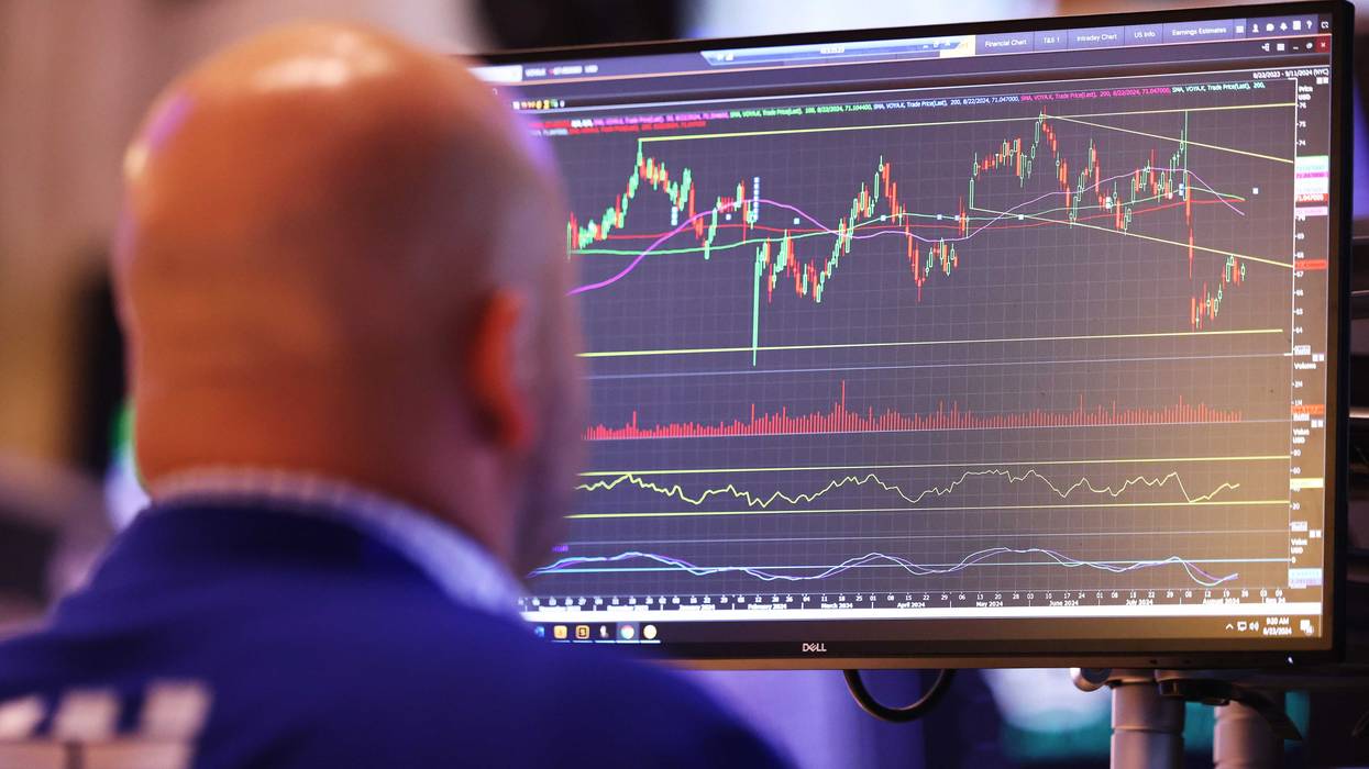 Traders work on the floor of the New York Stock Exchange