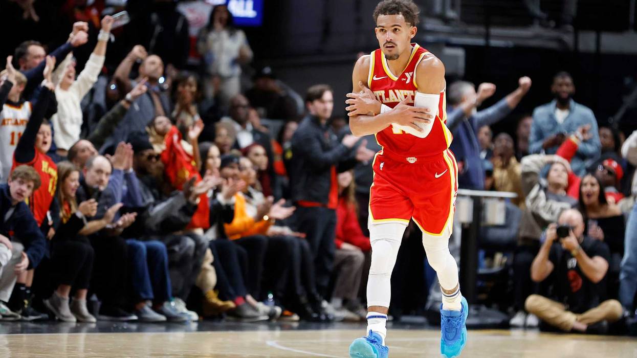 Trae Young #11 of the Atlanta Hawks reacts after a three-point basket against the Brooklyn Nets during the second half at State Farm Arena