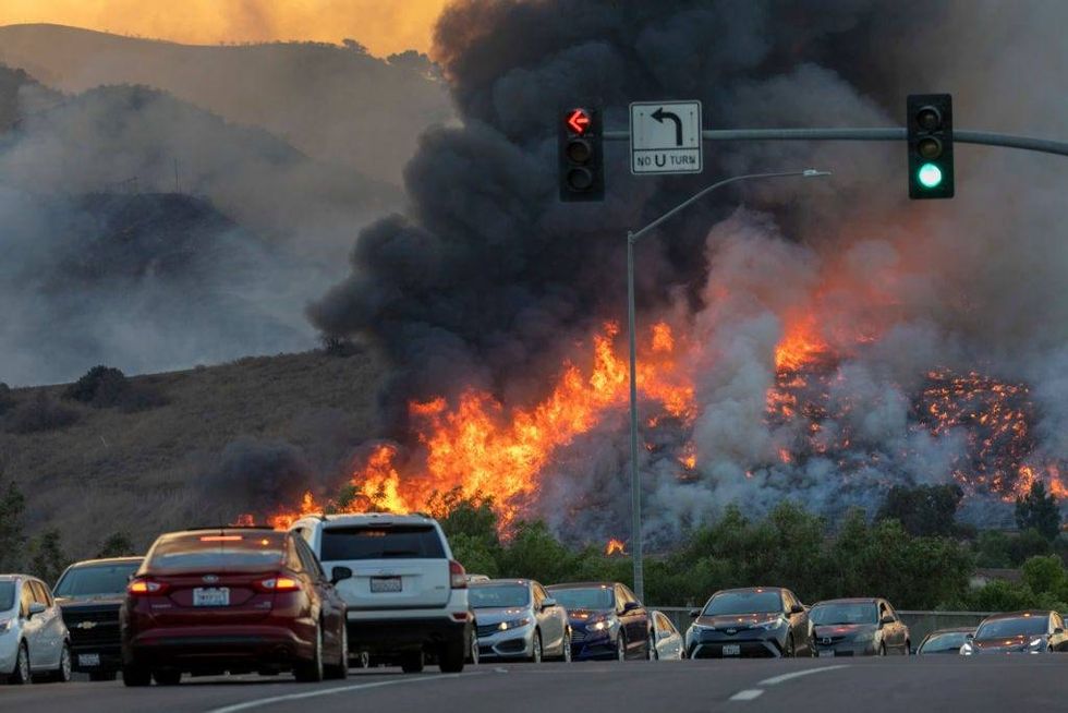 Traffic is diverted off of the 71 freeway during the Blue Ridge Fire on October 27, 2020 in Chino Hills, California.