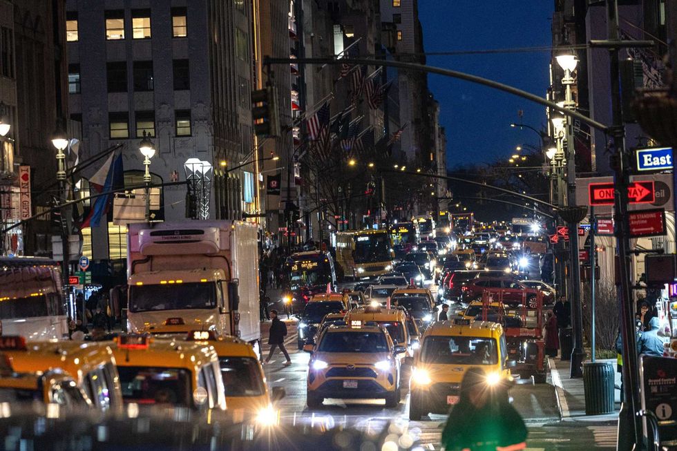 Traffic moves along Midtown Manhattan on February 19, 2025