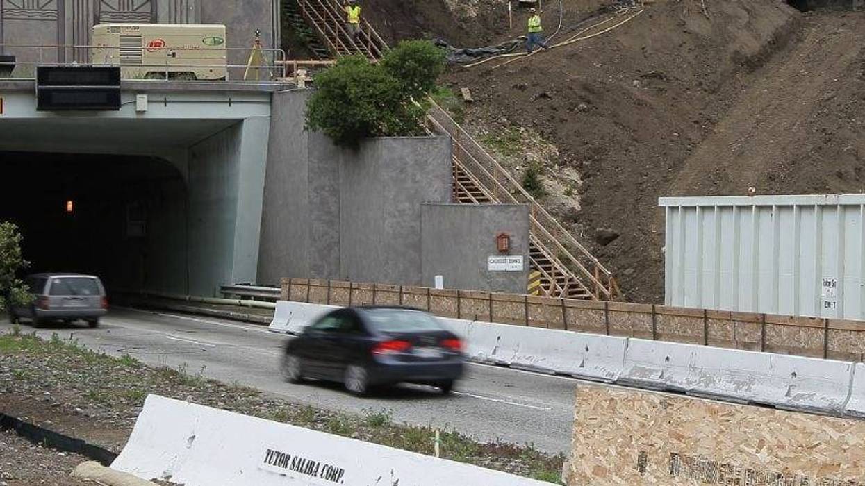 : Traffic moves by a construction site at the Caldecott Tunnel fourth bore project June 3, 2010 in Orinda, California.