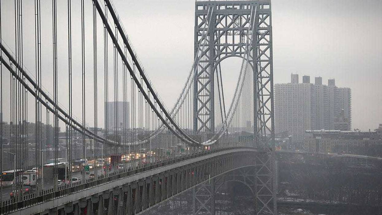 Traffic moves over the Hudson River and across the George Washington Bridge between New York City (R), and in Fort Lee, New Jersey on December 17, 2013.