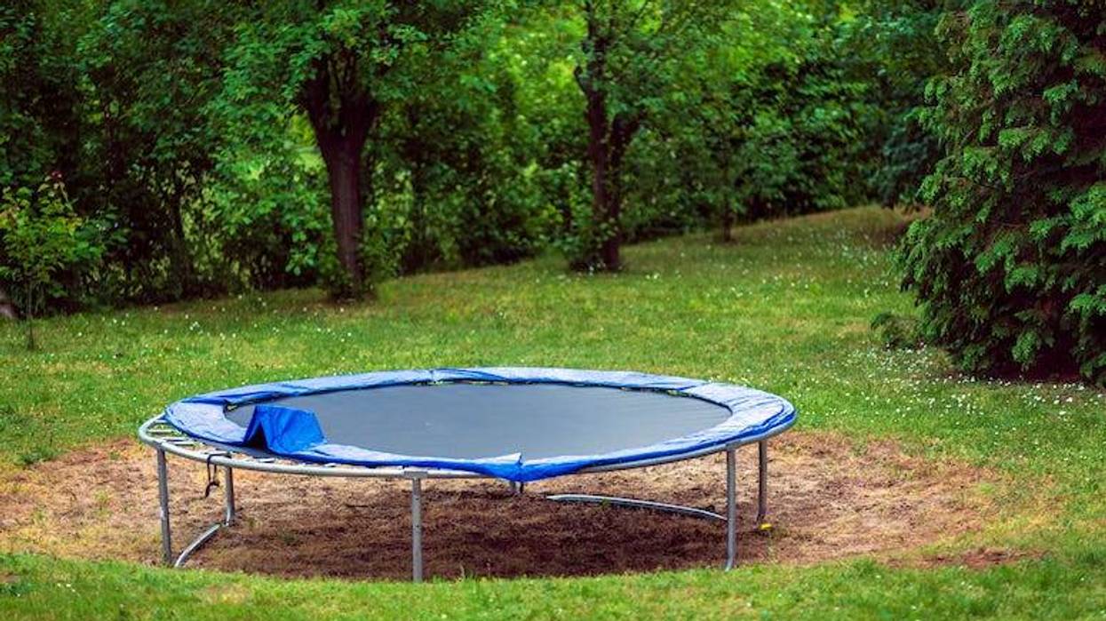 Trampoline in a yard