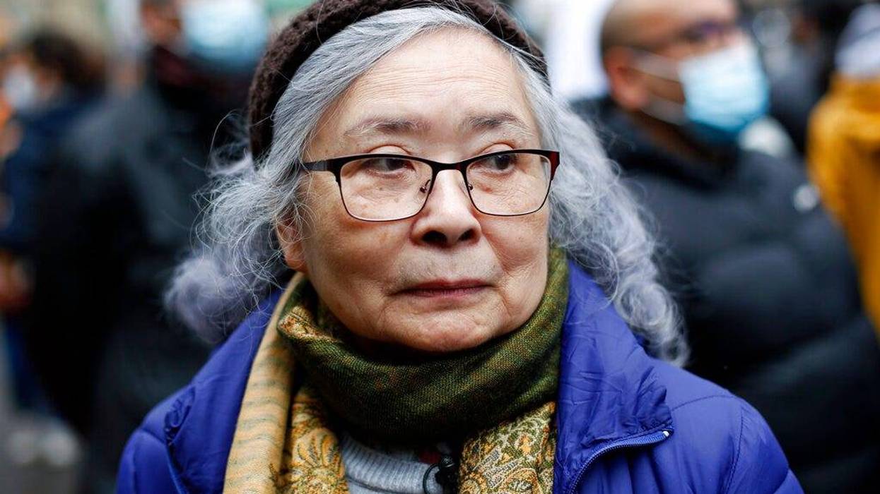 Tran To Nga, a 78-year-old former journalist, attends a gathering in support of people exposed to Agent Orange during the Vietnam War, in Paris, Saturday Jan. 30, 2021. Activists gathered Saturday in Paris in support of people exposed to Agent Orange during the Vietnam War, after a French court examined a case opposing a French-Vietnamese woman to 14 companies that produced and sold the toxic chemical. (AP Photo/Thibault Camus)