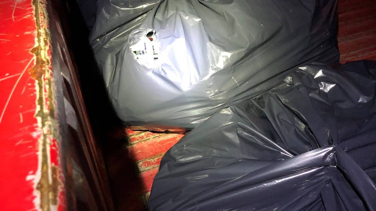 Trash bags filled with mail were found in the back of the suspects' car.