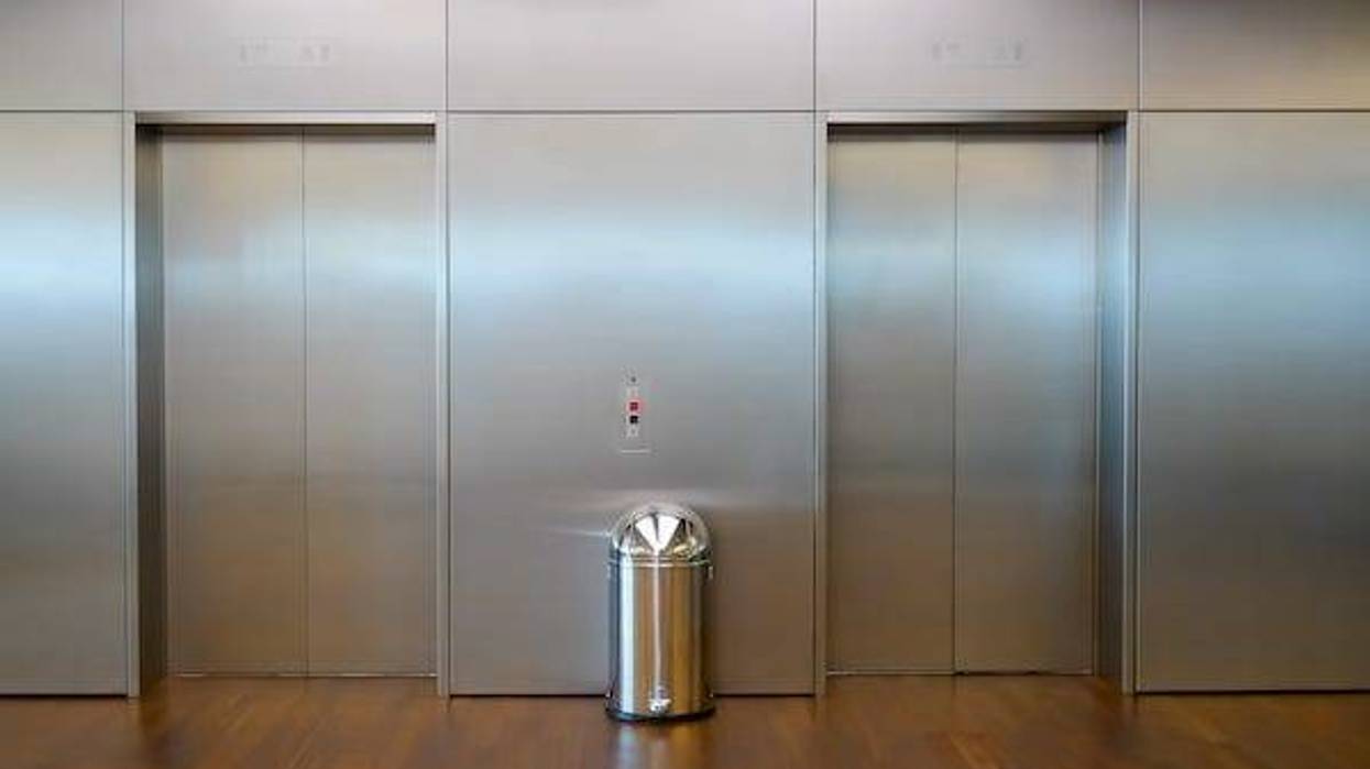 Trash can in elevator lobby
