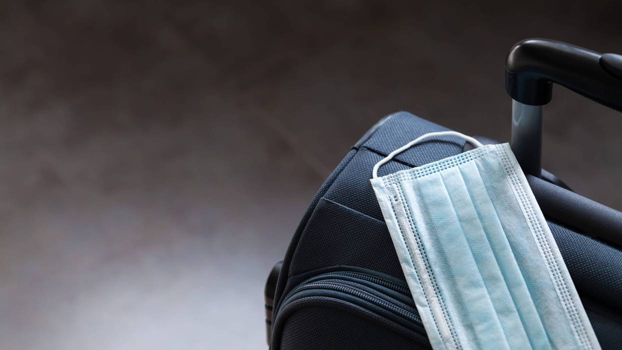 Travel suitcase and medical mask