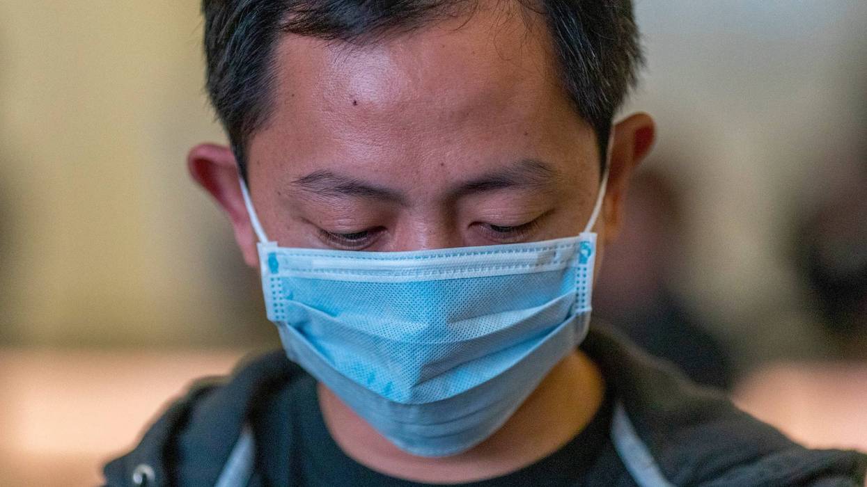 Travelers arrive to LAX Tom Bradley International Terminal wearing medical masks for protection against the novel coronavirus outbreak on February 2, 2020 in Los Angeles.