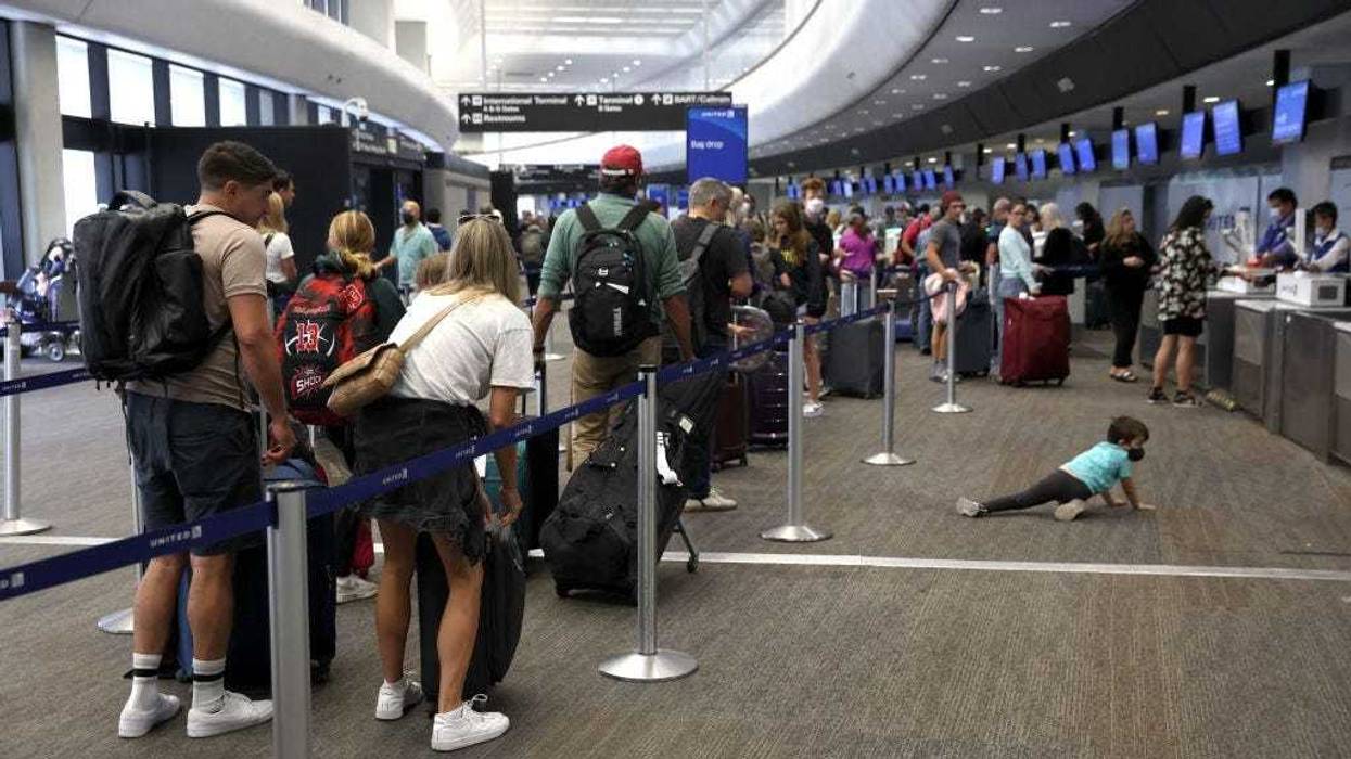 Travelers line up to check in for United Airlines flights at San Francisco International Airport on July 01, 2022 in San Francisco, California.