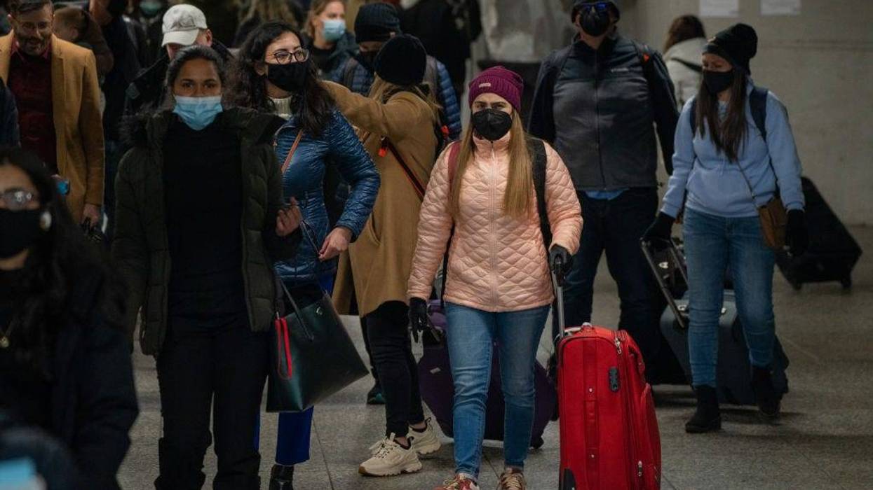 Travelers make their way through Penn Station on November 24, 2021 in New York City