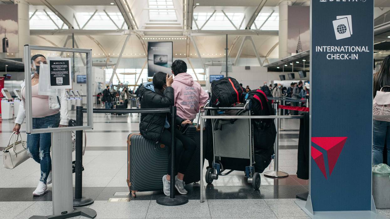 Travelers move through the departures hall at Terminal 4 of John F. Kennedy International Airport on December 24, 2021 in New York City.