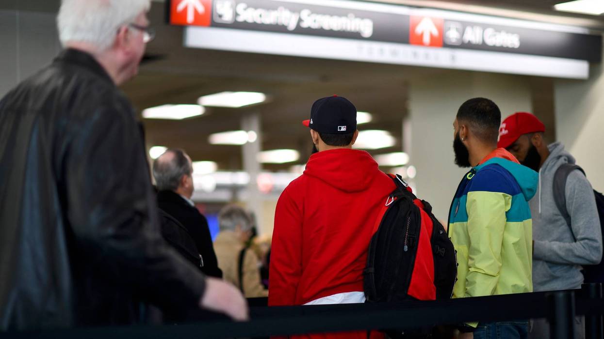 Travelers wait in long lines after Philadelphia Airport TSA and airport workers held a protest rally outside the Philadelphia International Airport on January 25, 2019.