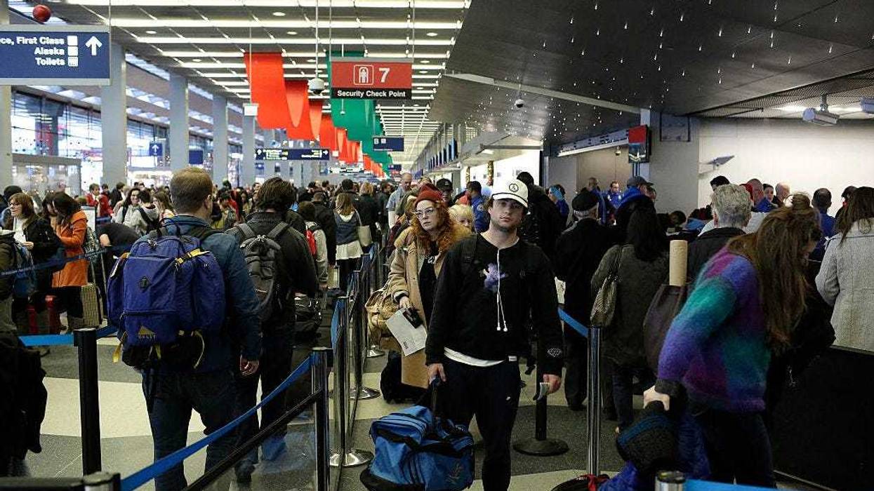 Travelers wait in the TSA security line at O'Hare International Airport on December 23, 2016 in Chicago, Illinois. O'hare International Airport is one of the busiest hubs in the nation during the weeks surrounding Christmas and New Years.