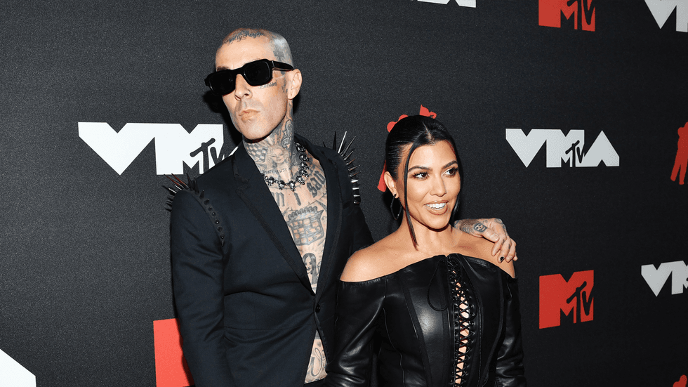 Travis Barker just covered up this name with a tattoo of Kourtney Kardashian's lips