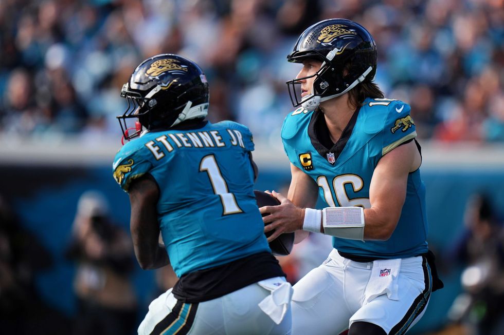 Travis Etienne Jr. and Trevor Lawrence