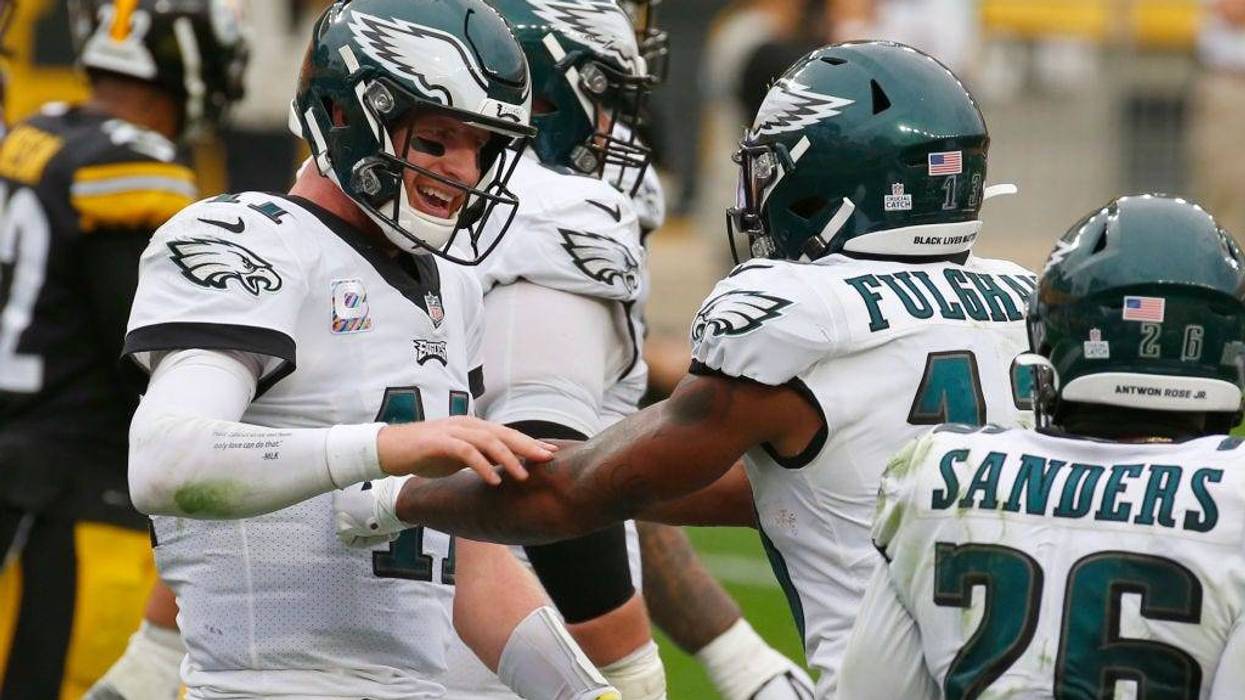 Travis Fulgham #13 of the Philadelphia Eagles celebrates with Carson Wentz #11
