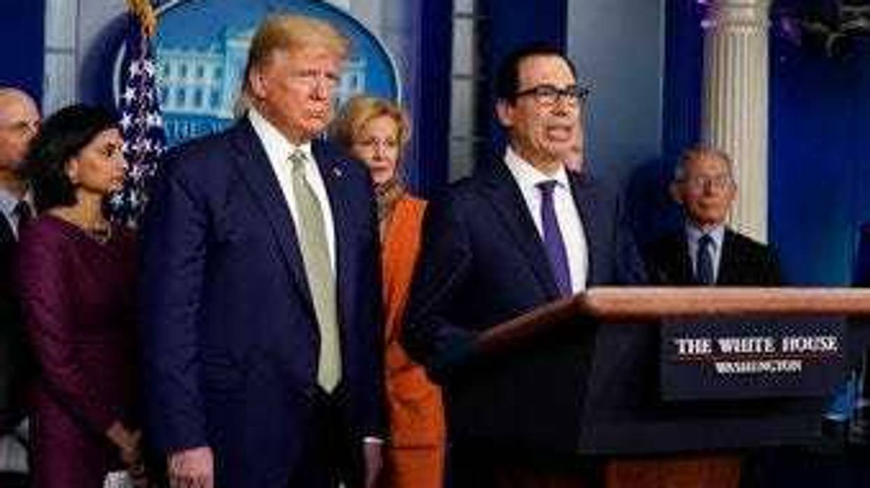 Treasury Secretary Steven Mnuchin speaks during a press briefing with the coronavirus task force, at the White House, Tuesday, March 17, 2020, in Washington, as President Trump looks on. (AP Photo/Evan Vucci)