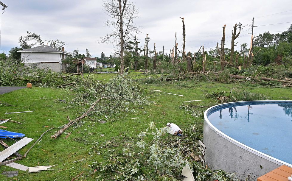 Trees line the ground from a tornado, in Rome, NY, Tuesday, July 16, 2024