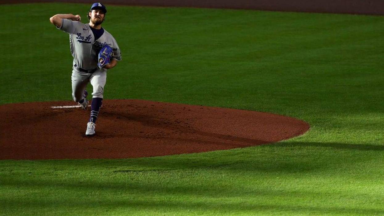 Trevor Bauer #27 of the Los Angeles Dodgers delivers a pitch during the first inning against the Houston Astros at Minute Maid Park on May 26, 2021 in Houston, Texas. (Photo by Carmen Mandato/Getty Images)