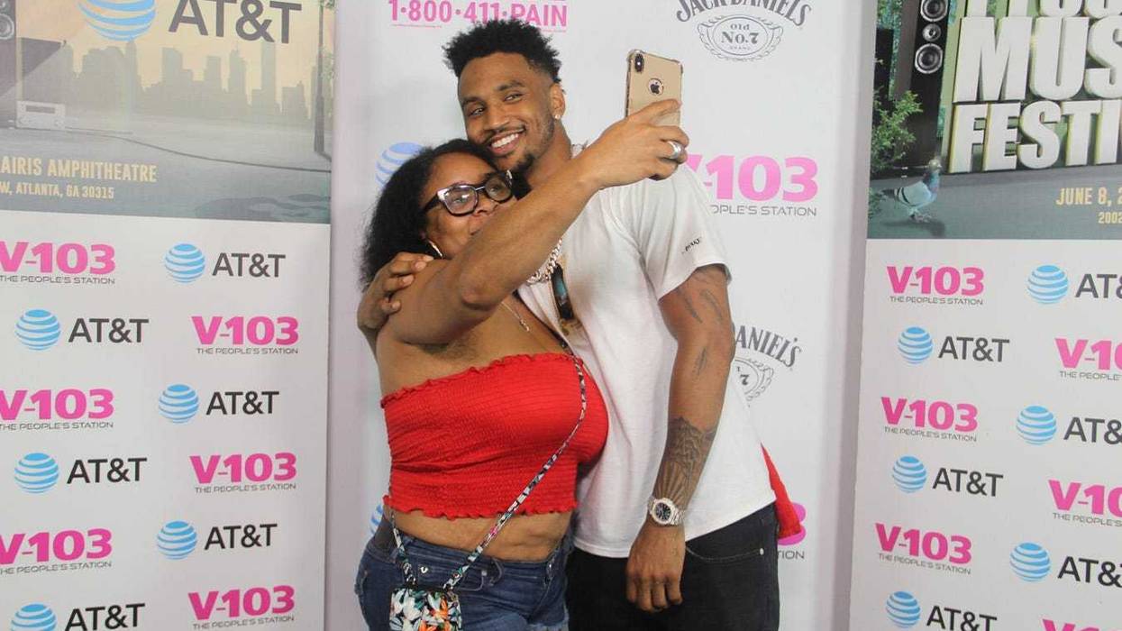 Trey Songz takes a photo with fans