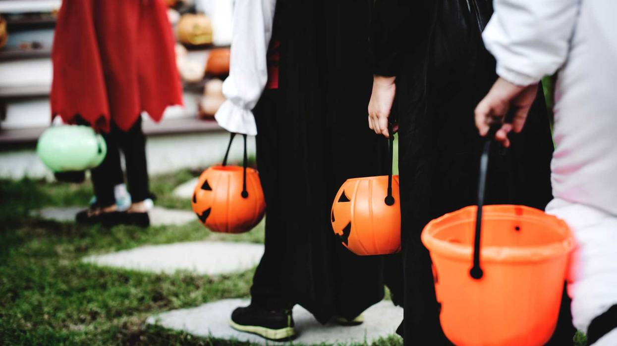 Trick or treaters approaching a house