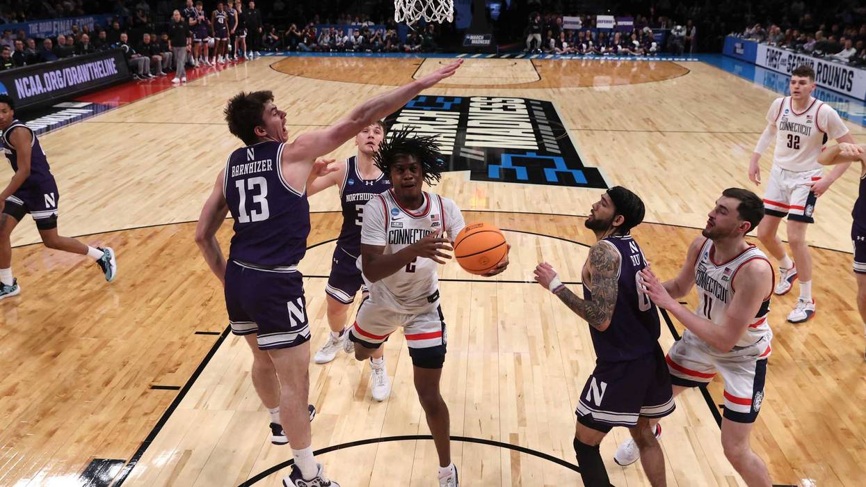 Tristen Newton of UConn drives to the basket against the Northwestern Wildcats during the second round of the NCAA Men's Basketball Tournament in Brooklyn, NY, 3/24/24