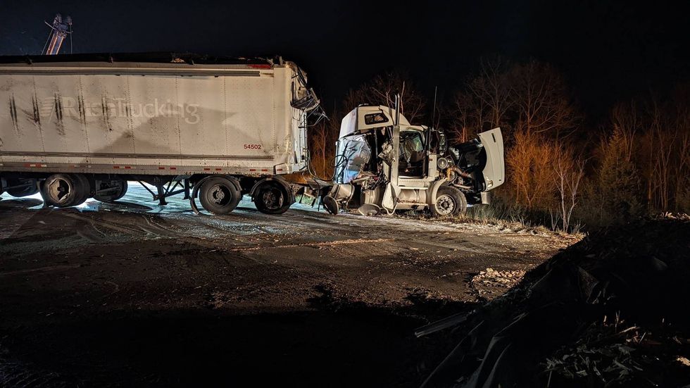 Troopers in Livingston County were forced to close a major freeway after a truck lost control in icy conditions and spilled thousands of pounds of mulch across the road.