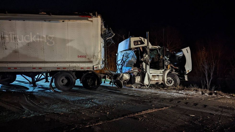 Troopers in Livingston County were forced to close a major freeway after a truck lost control in icy conditions and spilled thousands of pounds of mulch across the road.