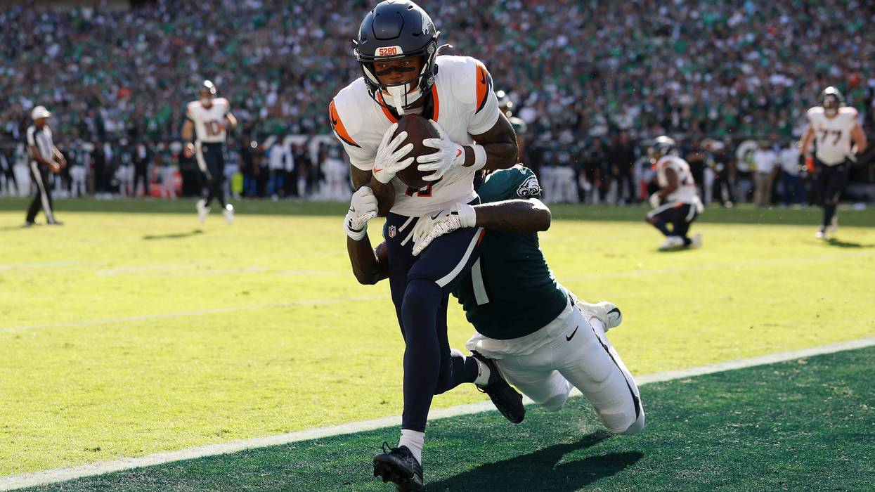 Troy Franklin of the Denver Broncos makes a reception to score a two-point conversion against Kelee Ringo of the Philadelphia Eagles during the fourth quarter in the game at Lincoln Financial Field on October 05, 2025.