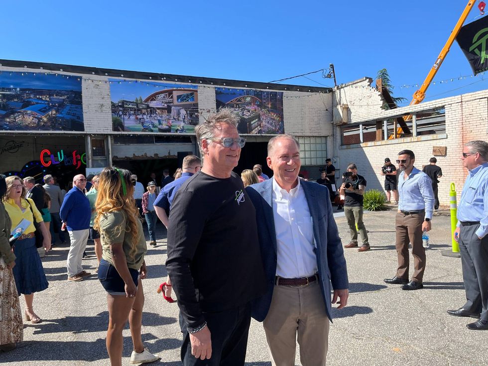 Trueline Founder and CEO Mike Grozier (left) and Greenville Mayor Knox White (right) in the space that will become the Trueline Greenville music venue